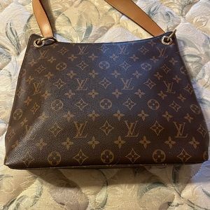 Faux Louis Vuitton style hand bag.